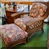 F66. Wicker chair and ottoman.